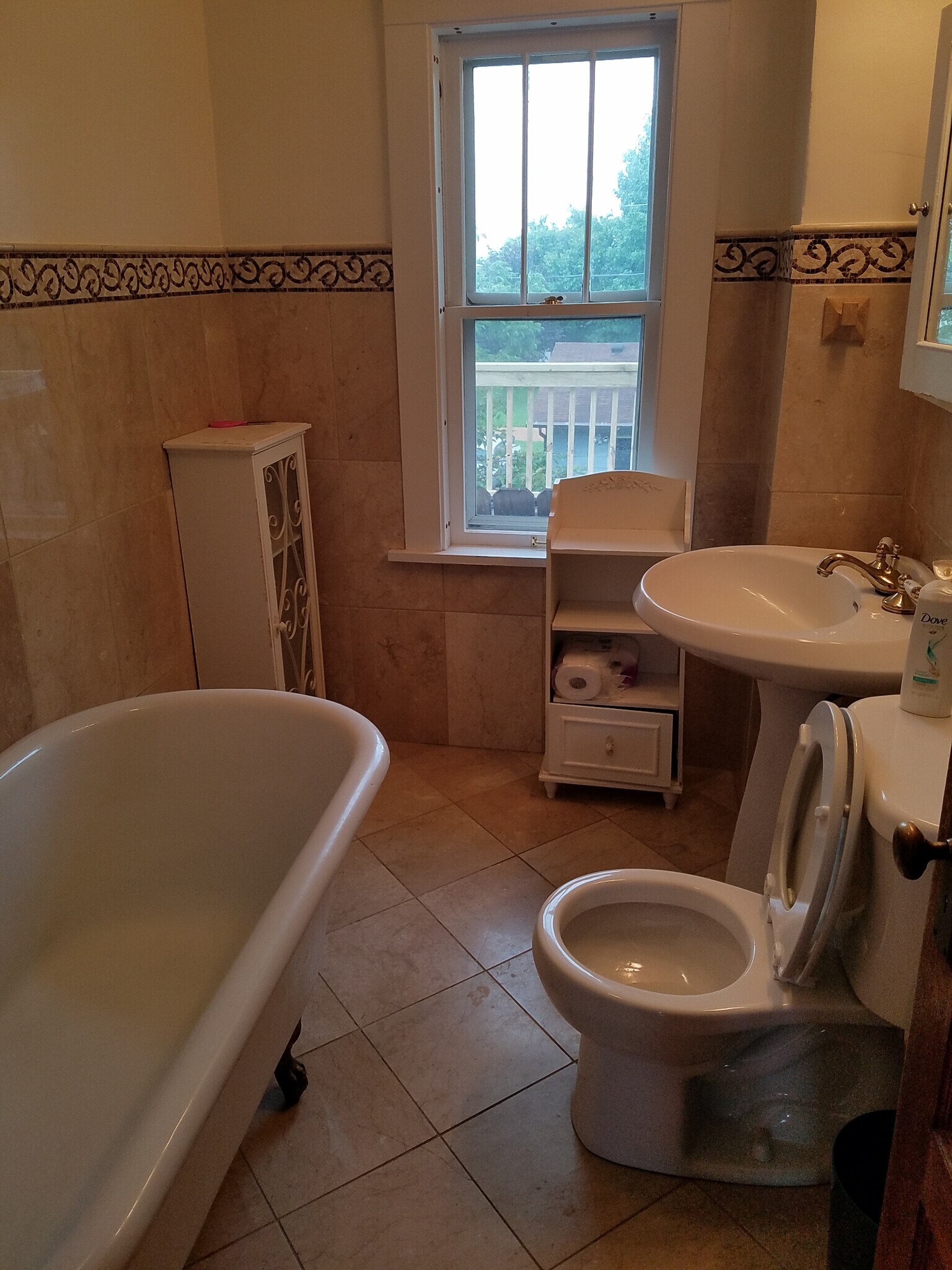 Marble bathroom with clawfoot tun and a heated floor for those cold Minnesota winter mornings. - 106 SE 2nd Ave