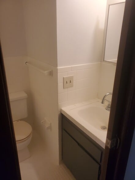 Full Bathroom Toilet and sink linen closet right outside of bathroom with lots of storage - 1182 Lane Pl