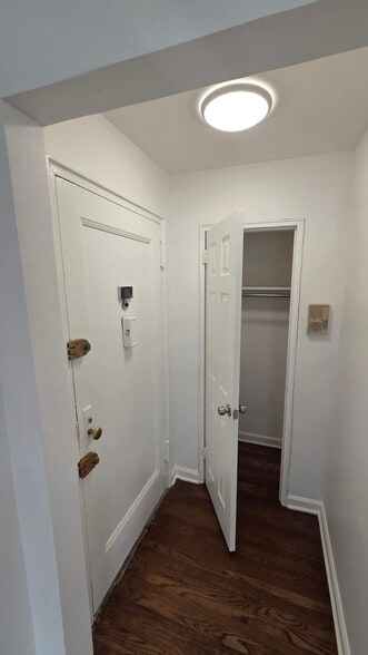Bedroom with large closet and refinished hardwood floors - 165 Vroom St