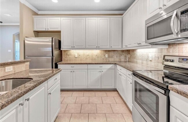 Building Photo - College Station - 3 bedroom / 3 bath Townhome, covered patio & back yard with one car garage.