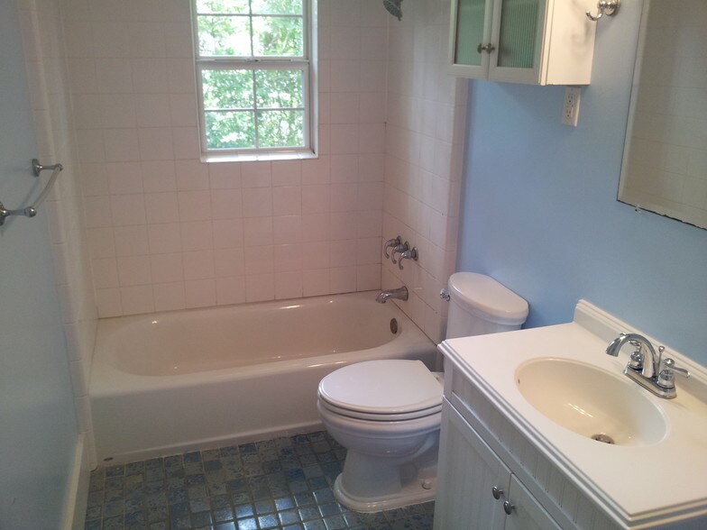 Bathroom with heated tile floor. - 311 W Mill St