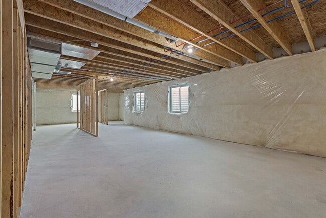 Building Photo - NEW HOME with large garage stalls and unfinished basement for additional storage