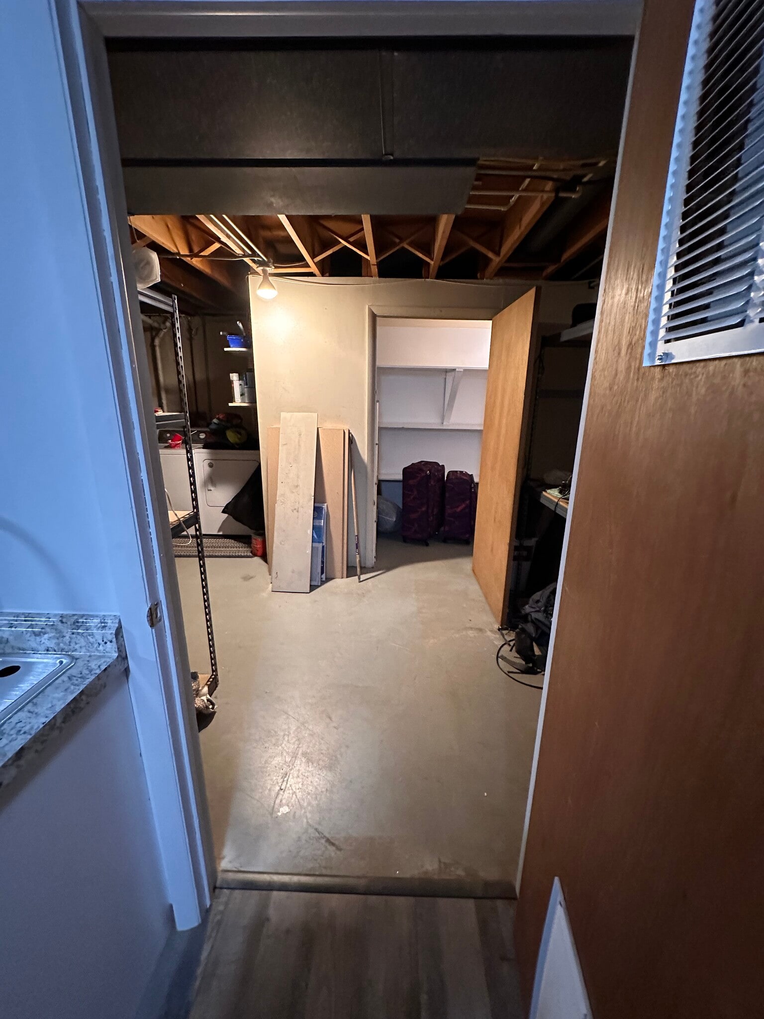 Laundry/Utility/Storage with additional storage under stairs - 815 Kingsley Dr