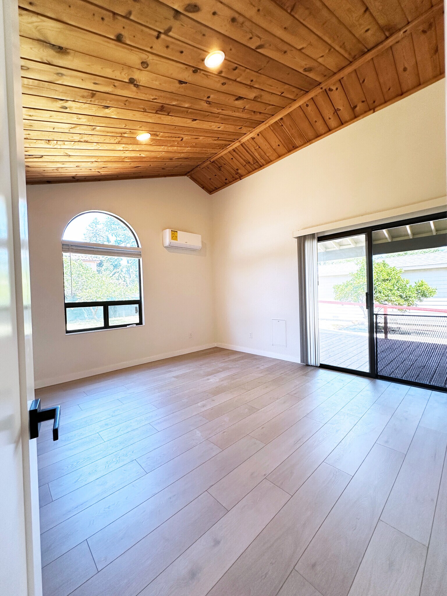 Master bedroom retreat with vaulted ceiling, dual closets, and easy access to outdoor living. - 4570 58th St