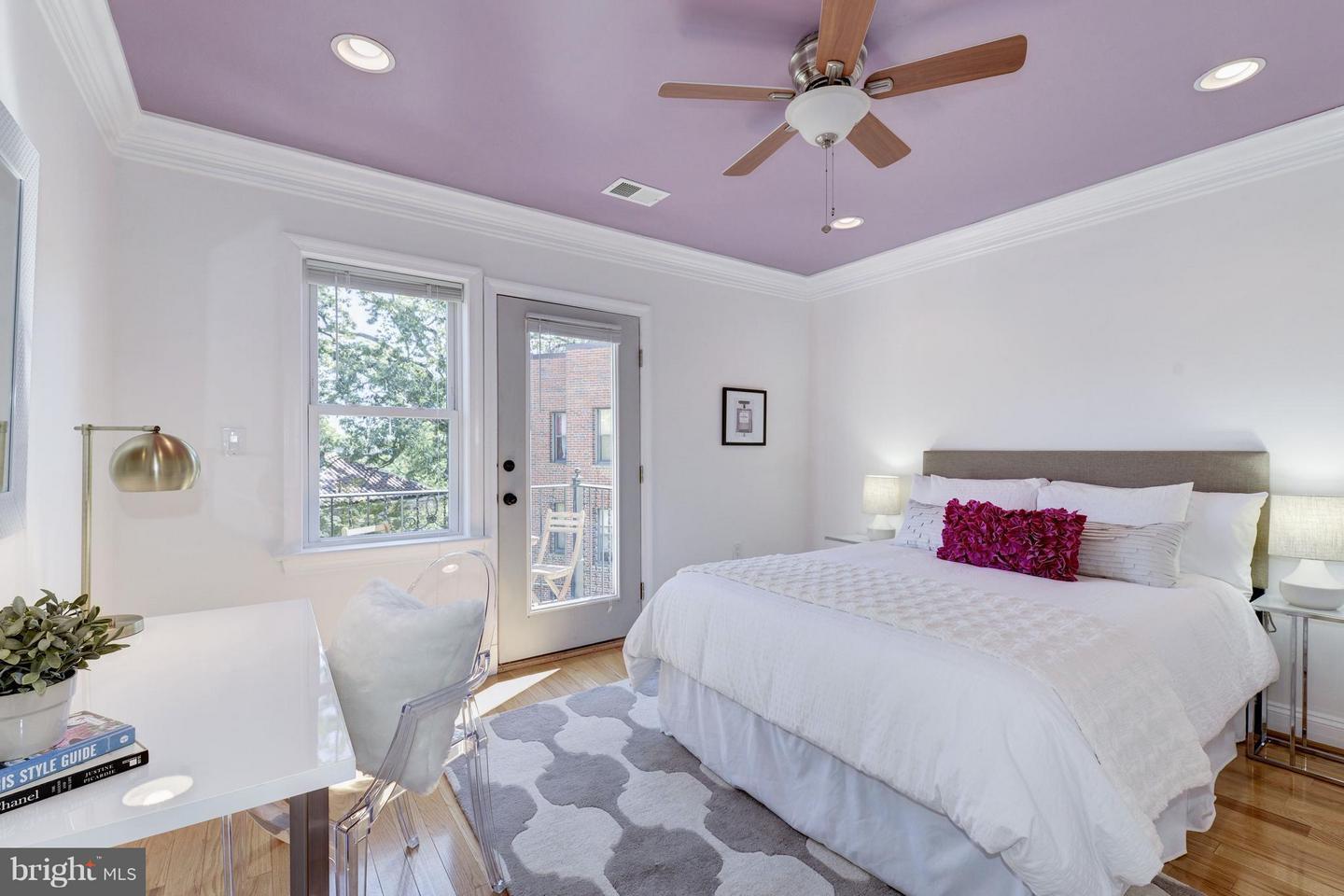 Second bedroom with crown molding and ceiling fan - 5511 Colorado Ave NW