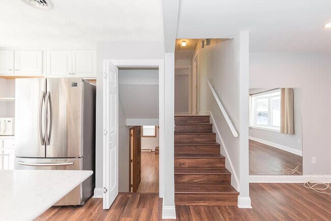 Stairs downward lead to large family room with fireplace - 1105 Golfview Dr