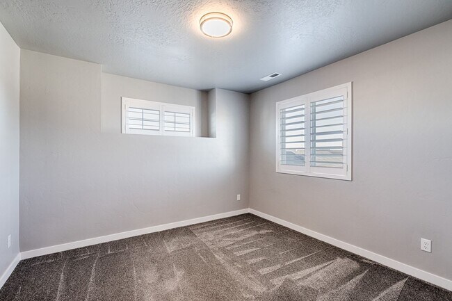Building Photo - Custom Hunter-Douglas shutters throughout.