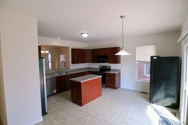 Building Photo - Spacious 4BR Home with Garage Steps from C...