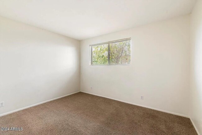 2nd Bedroom. 13ft x 11ftPerfect for a Roommate, Office, or Spare Bedroom for Friends and Family - 6935 E 4th St