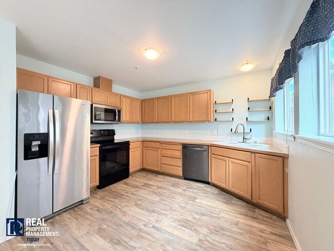 Building Photo - Spacious 4-Bedroom Townhome in Alicia Meadows | Garage, Patio & Pet Friendly
