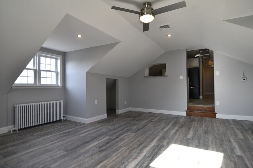 Living Room. Recessed lighting, ceiling fan, two large radiators keep you toasty in the winter. Large closet space for storage. - 309 Old York Rd