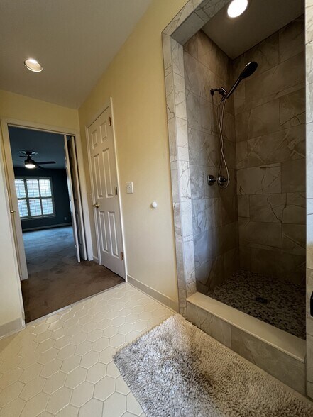 Primary bathroom with tub, shower, and double vanity. - 604 Sherbourne Grn