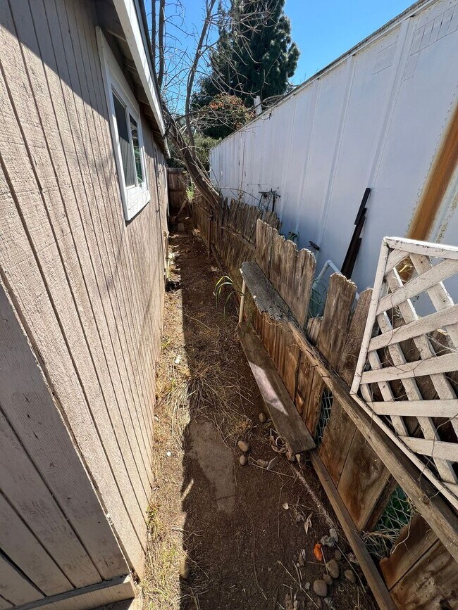 Building Photo - Private Detached House with Fenced Yard and Large Covered Carport