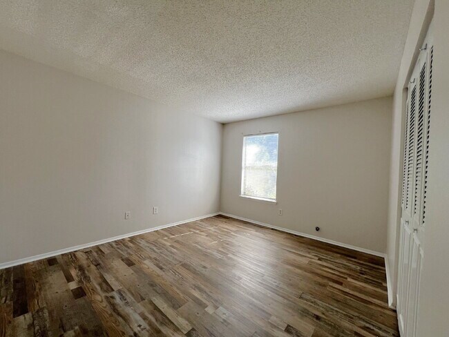 Building Photo - Updated 2BR, 1BA Apartment Off Old Palafox Hwy with LVP Flooring Throughout, Vaulted Ceilings & W...