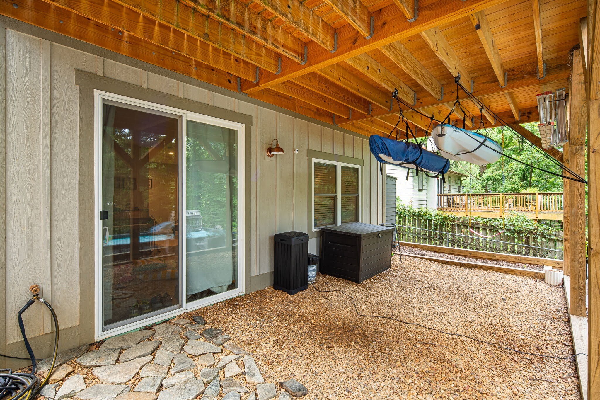 Lower deck area, two-thirds covered. Possibilities for storage, seating, or activity space. - 33 Rex Dr