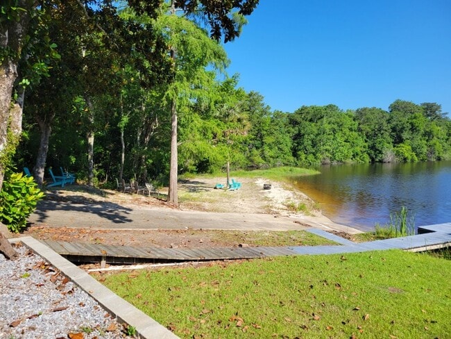 Building Photo - Riverfront Living with Private Boat Launch