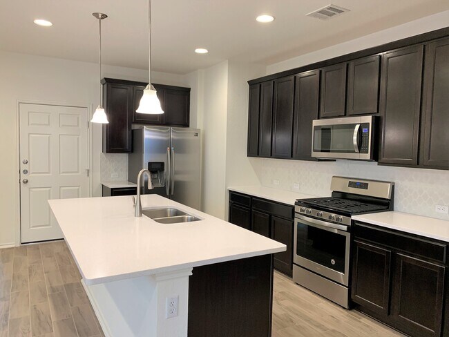 Building Photo - Home in The Village at Wells Branch