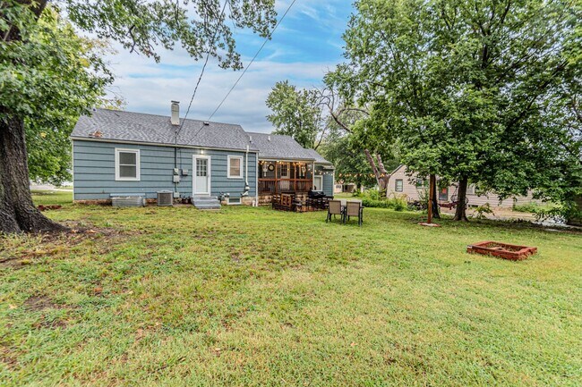 Building Photo - Back porch with a large yard!