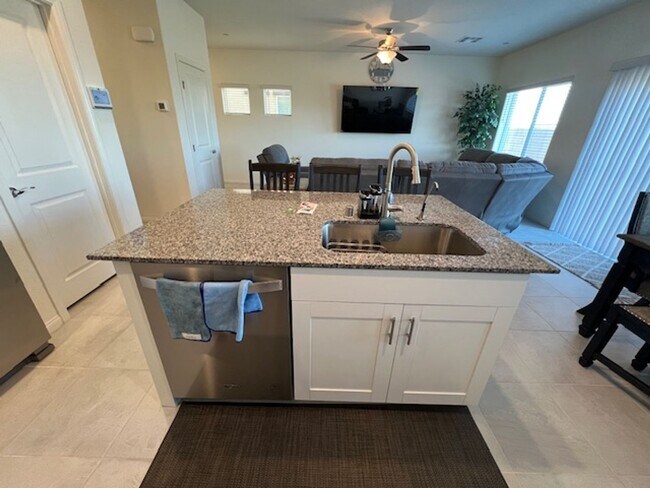 Building Photo - FULLY FURNISHED!!! beautiful 3 bedroom 2 and half bath home is located in the Symmetry Bay Cadenc...
