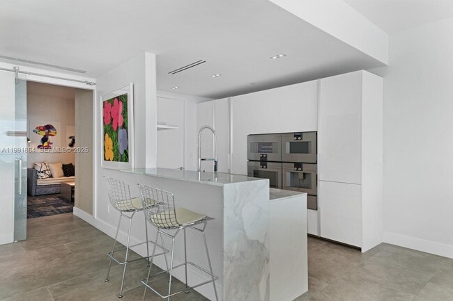 Building Photo - 10203 Collins Ave