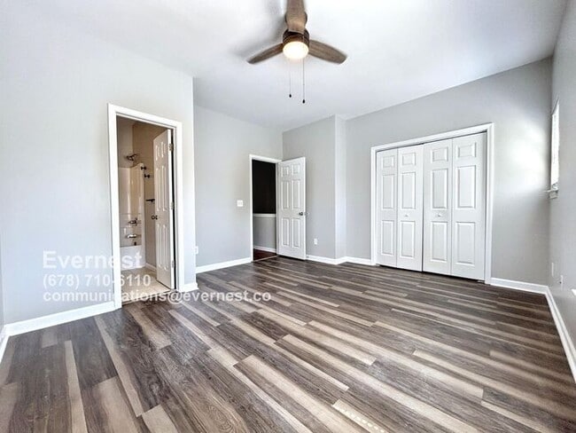 Building Photo - Spacious 4-Bedroom Townhome with Modern Co...