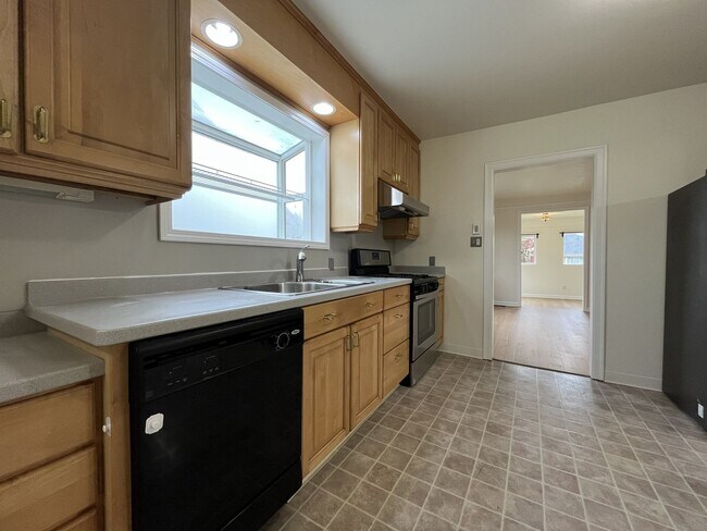 Building Photo - Character-Filled Concordia Home with Flexible Living Spaces & Gas Fireplace