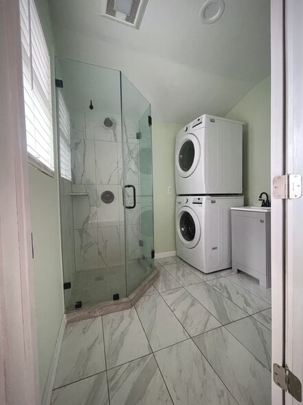 bathroom 1 with washer/dryer - 7949 Clearfield Ave