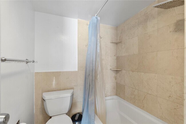 Building Photo - 3675 N Country Club Dr