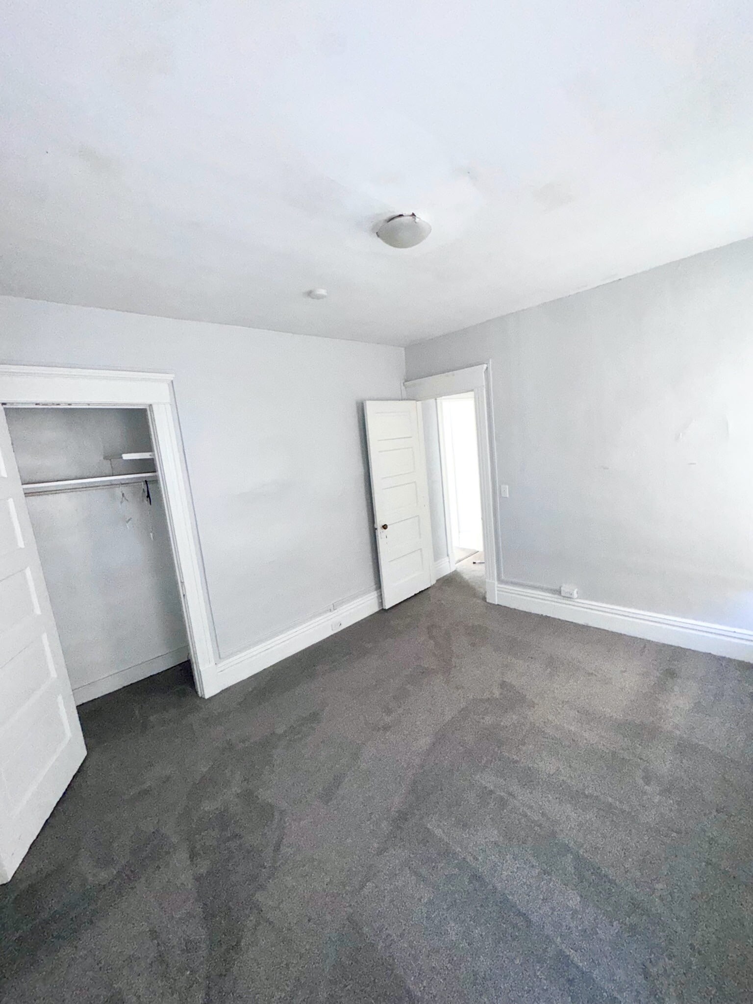 Master bedroom adjacent to bathroom. - 1118 W 8th St