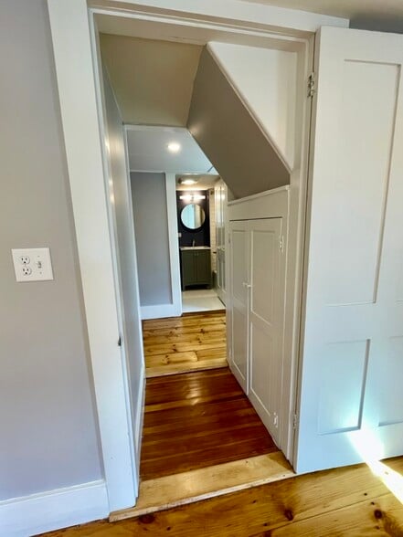 A view from the main bedroom to the full bath showing one of the two linen closets on the right. - 20 Chapel St