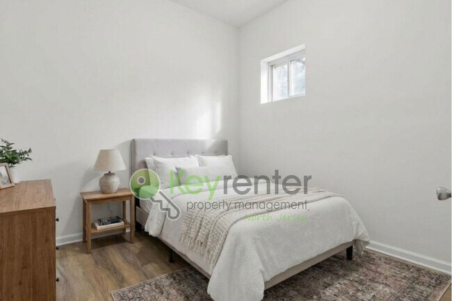 Building Photo - Rare Renovated 3BR/2BA Townhouse with Private Yard & NYC Views