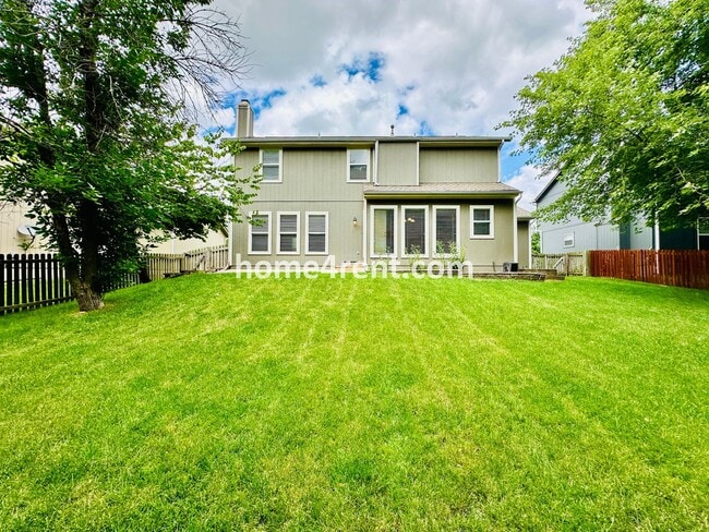 Building Photo - Beautiful Four-Bedroom Home with Three Car Garage, Wood Floors, Finished Basement and a Fenced Ya...