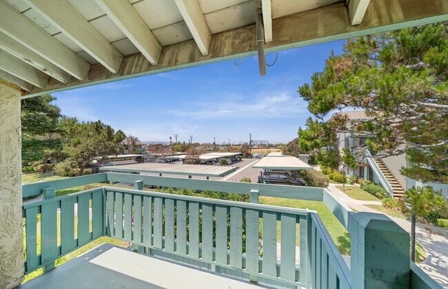 Balcony overlooking covered parking spot - 20415 S Vermont Ave