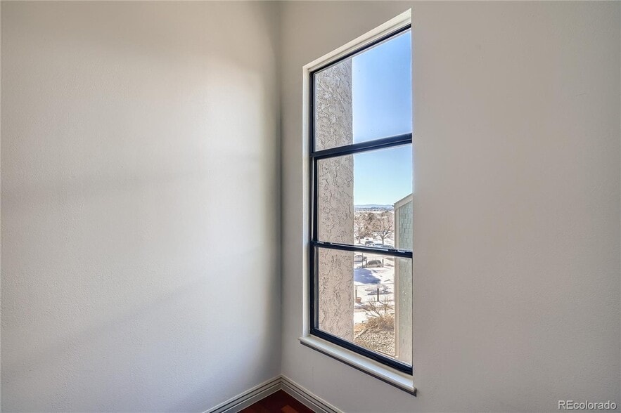 Larger window in primary bedroom with mountains and pool views - 14282 E Tufts Pl