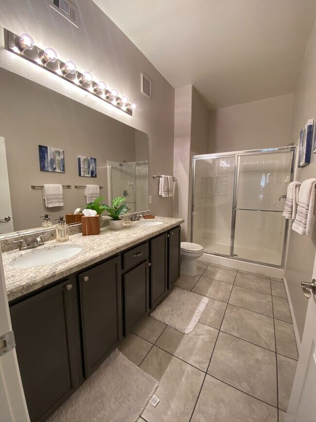 Building Photo - BEAUTIFUL CONDO IN A GATED COMMUNITY FEATURING PLANTATION SHUTTERS, TILE FLOORING AND NEW PAINT T...