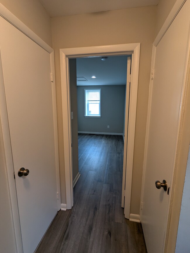 entrance to bedroom 3, linen closet on the right, laundry on the left - 205 Bates St NW