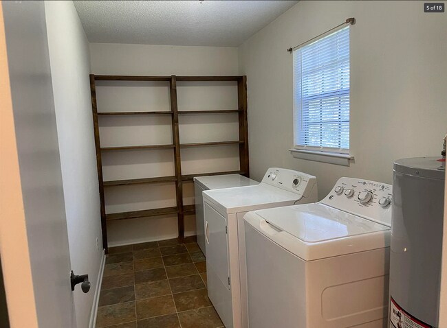 Spacious living room with plenty of storage - 714 Woodland Dr S