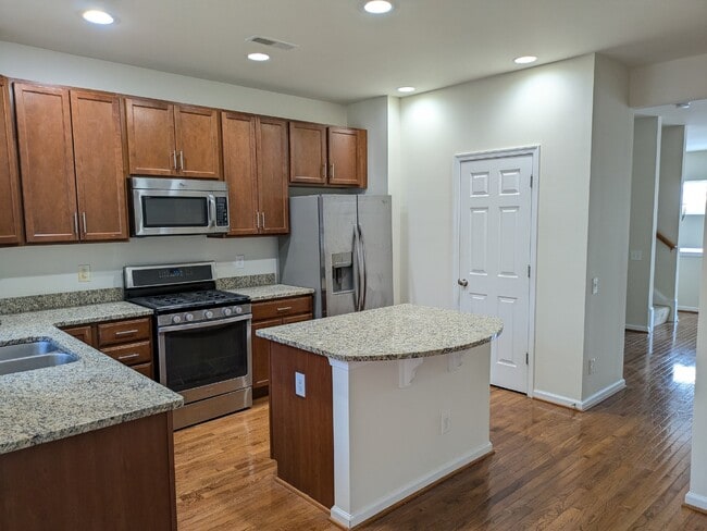 Building Photo - Brambleton Elegance: A Spacious Townhome Oasis