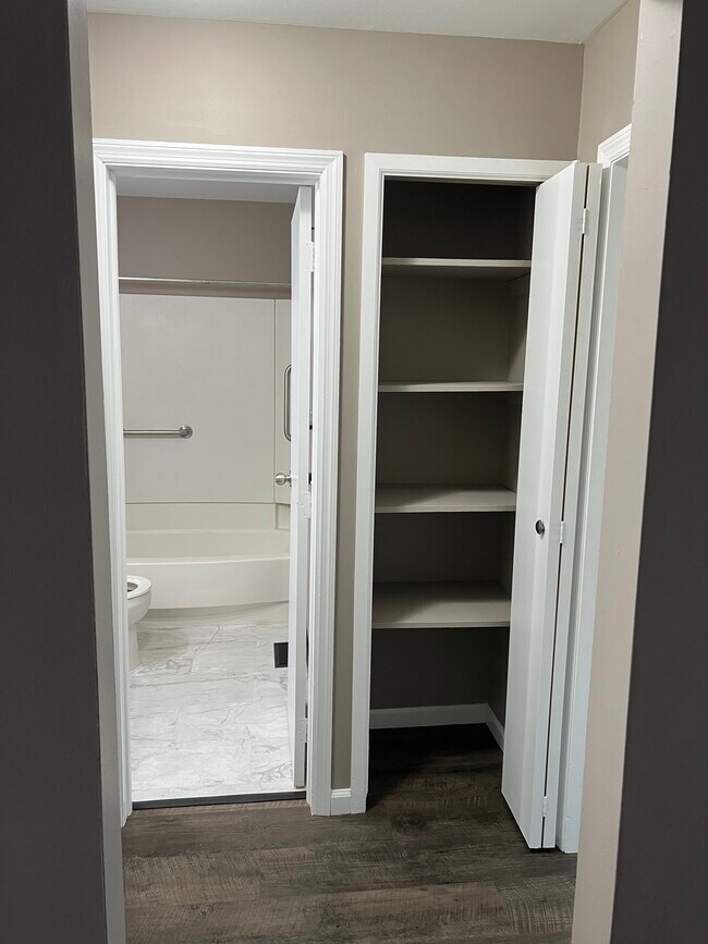 Hallway into bathroom with linen closet - 2275 N Cable Rd