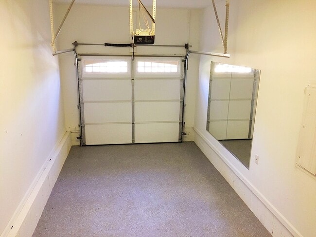 Also inside the laundry room is access to the garage, with brand new epoxy speckled grey flooring - 190 Hutchinson St NE