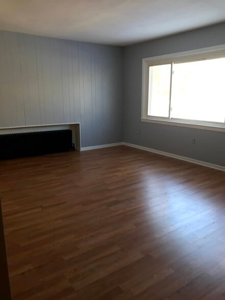 Large sunlit living room with picture window - 52 Orchard Street