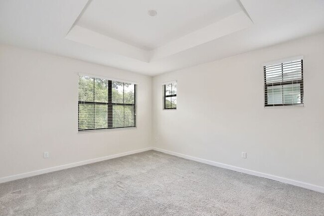 Building Photo - Beautiful 4/3.5 Townhome with a Spacious 2 Car Garage Located in Trails at Moss Park - Orlando