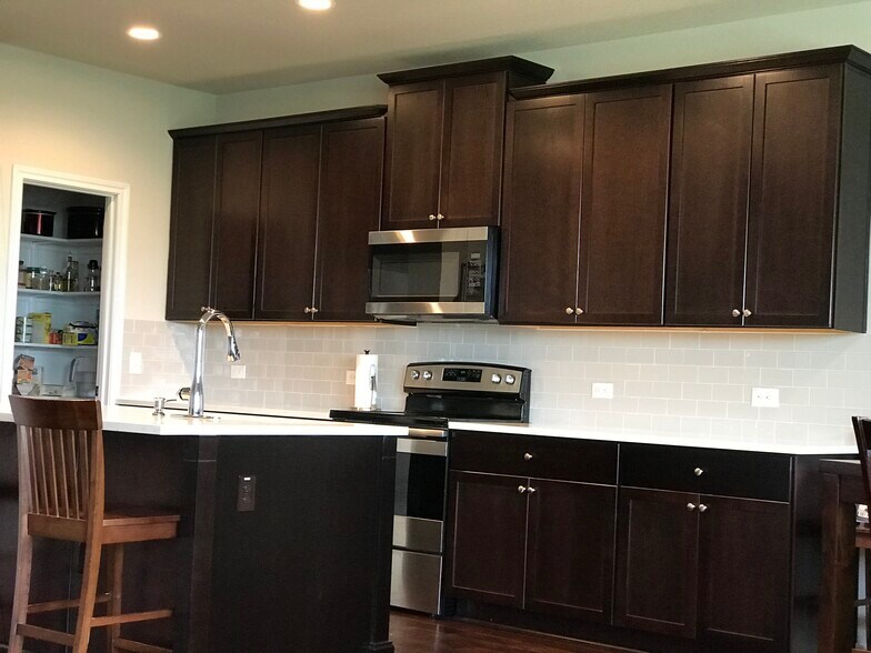 Kitchen area, Kitchen Island white quarry countertops - 1313 Eagle Ridge Trl