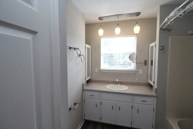 Building Photo - Live the Gulf Breeze Waterfront Life – Dock, Canal Access & Boat Lift!