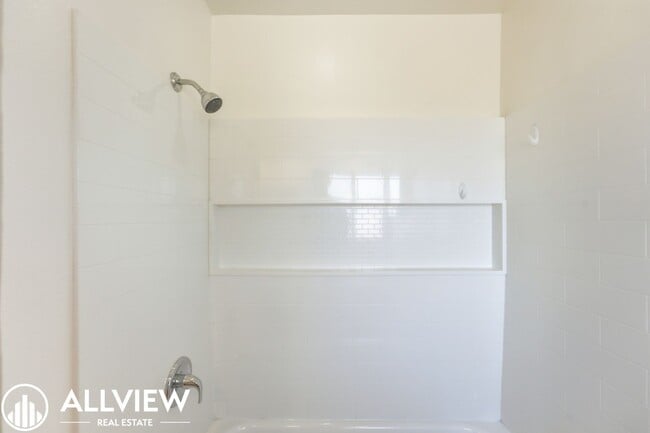 Building Photo - Fully Renovated 2 Bed Townhome with Private Patio, 2-Car Garage & Community Pool