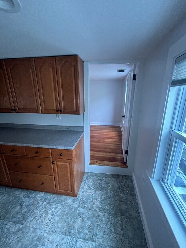 plenty of cabinet space and the second, smaller bedroom off of the kitchen - 15 Eastern Ave