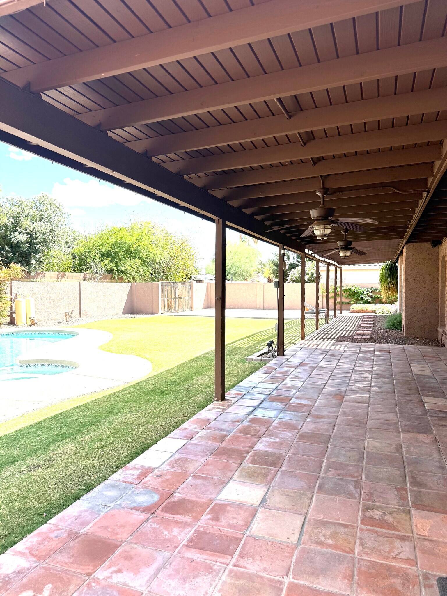 Saltio tiles and ceiling fans along back patio which gets plenty of afternoon shade - 8315 S Taylor Dr
