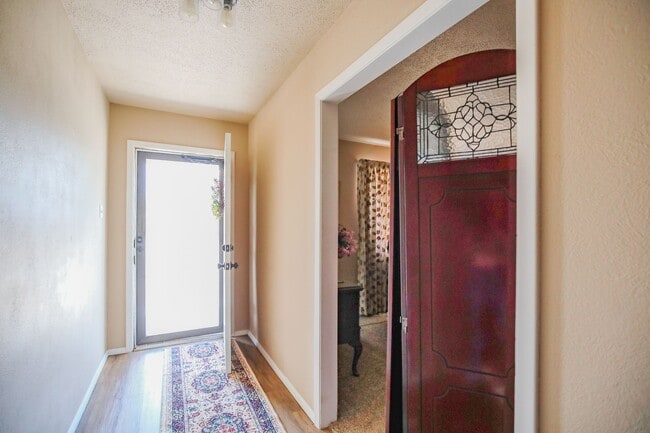 Building Photo - Three Bedroom Home with Plush Backyard