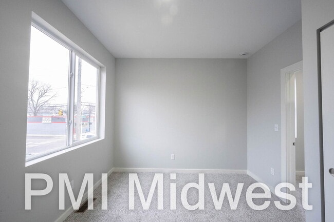 Building Photo - "Charming 2-Bedroom Gem with 1.5 Baths on East Michigan Street – A Cozy 949 Sq. Ft. Haven in Indi...