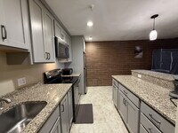 Building Photo - Modern & furnished studio unit available NOW!